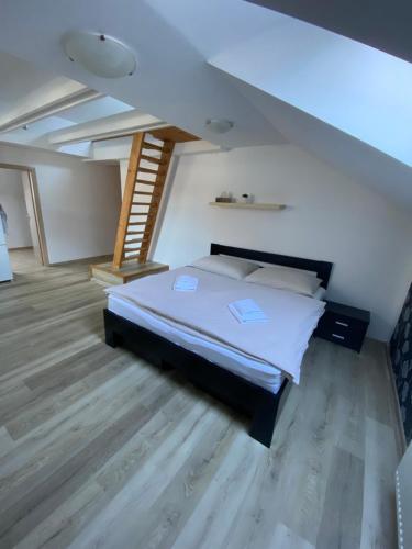 A bed or beds in a room at Ager Apartments