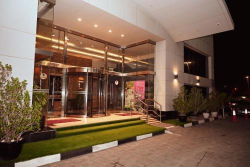 an external view of a building at night at V Hotel Fujairah in Fujairah