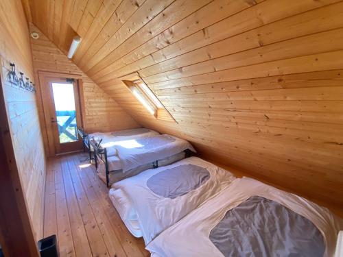 Postel nebo postele na pokoji v ubytování Spa and View Cozy House スパアンドビューコージーハウス