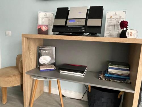 a desk with a computer on a shelf at DoubleL Studios in Bacău