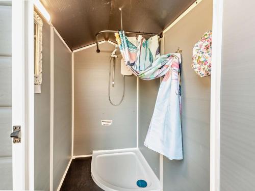 a small bathroom with a toilet and a sink at 1 Bed in Llanrhaeadr 91890 in Llanrhaiadr