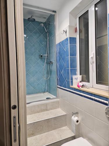 a bathroom with a shower and a toilet and a sink at Sunny House Apartment 44 Malta in Taʼ Xbiex