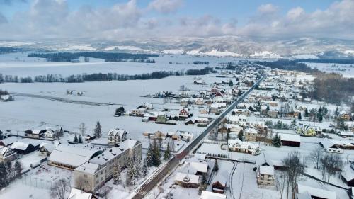 an aerial view of a town covered in snow at Apartament Janusza in Gronków