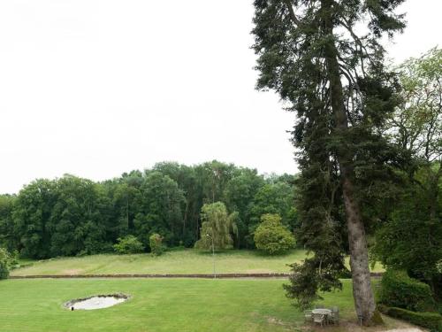 a park with a picnic table and a tree at Château de Perreux, The Originals Collection in Amboise