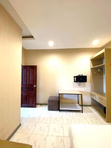 a living room with a couch and a table at White Residence Hotel & Apartment in Phnom Penh