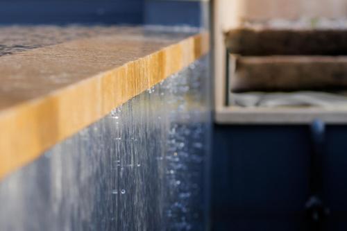 a close up of a counter with water on it at Domaine de Chabanne in Crupies