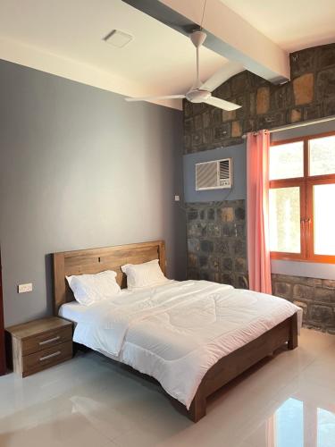 Jabal Shams Villa tesisinde bir odada yatak veya yataklar
