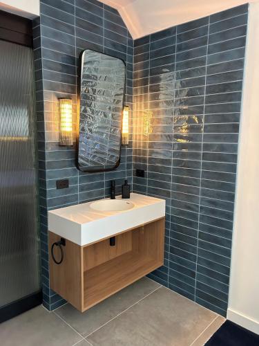 a bathroom with a sink and a mirror at 187 Heathcote in Heathcote