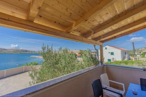 a view of the water from the balcony of a house at Katarina 1 in Zubovići