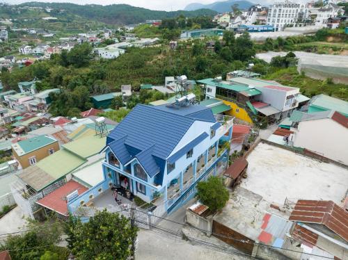 an overhead view of a city with a blue house at Nhà Giáng Sinh Trên Đồi Villa in Da Lat