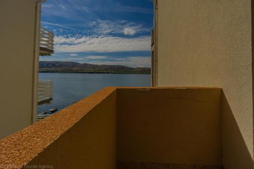 a balcony with a view of a body of water at Katarina 1 in Zubovići