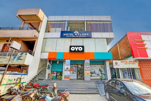 a building with motorcycles parked in front of it at OYO Hotel My Lord in Bhopal