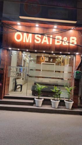 a store front with potted plants in front of it at OM SAI B&B in Amritsar