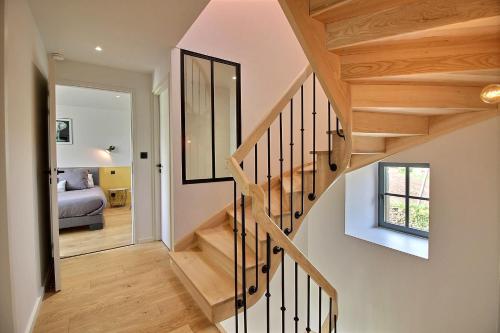 a staircase in a house with a bedroom at A l'abri des pins in Pleubian
