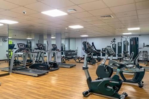 a gym with several treadmills and exercise bikes at Pure Living - Spacious & Relaxing 2BR Apartment in Dubai Marina in Dubai