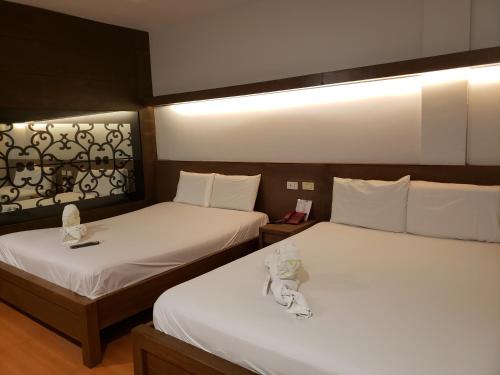 Postel nebo postele na pokoji v ubytování Le Verde Lodge