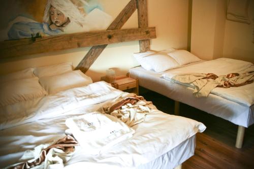 Tempat tidur dalam kamar di Impresja Krasiczyn