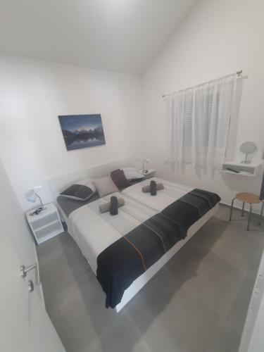 Ένα ή περισσότερα κρεβάτια σε δωμάτιο στο Palace Deluxe II