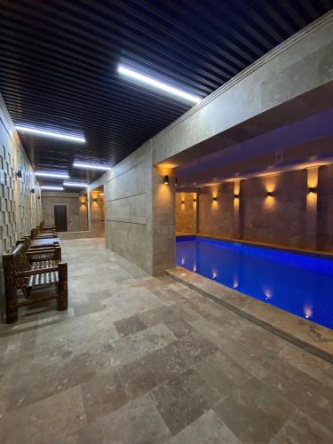 an empty hallway with a pool in a building at GM Rest House in Tsaghkadzor