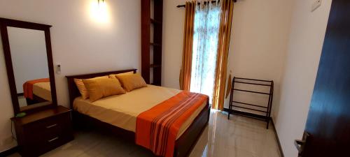 Ένα ή περισσότερα κρεβάτια σε δωμάτιο στο Cinnamon Avenue Villas- Negombo - Sri Lanka