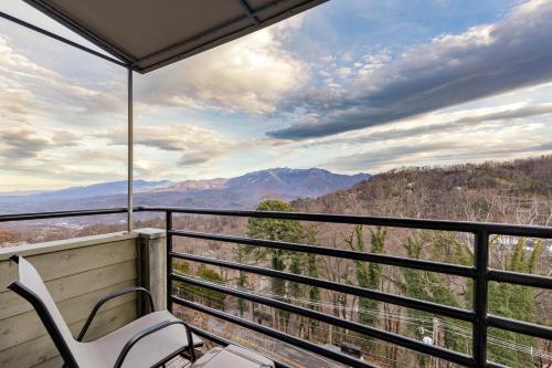 a balcony with a chair and a view of the mountains at Gatlinburg Summit Smoky Mountains View in Gatlinburg