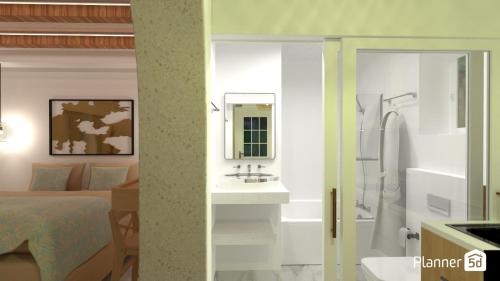 Cette chambre comprend un lit, un lavabo et une salle de bains. dans l'établissement Alykes Studios & Suites, à Ágios Prokópios