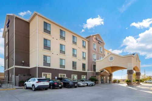 a large building with cars parked in front of it at Comfort Inn by Choice Hotels Orange, TX in Orange
