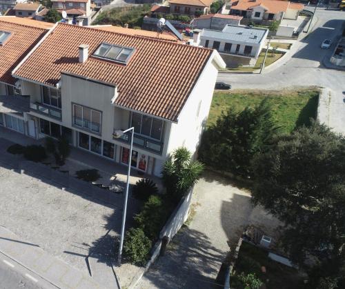 an aerial view of a white house with a red roof at Casa da Barragem in Marco de Canaveses
