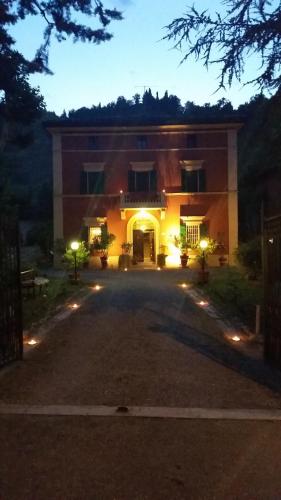 a large building with a driveway in front of it at Villa Storica Calderino in Monte San Pietro