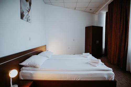 Ένα ή περισσότερα κρεβάτια σε δωμάτιο στο Hotel Select
