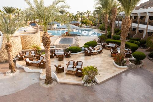 an aerial view of a resort with a pool and palm trees at Turquoise Beach Hotel in Sharm El Sheikh