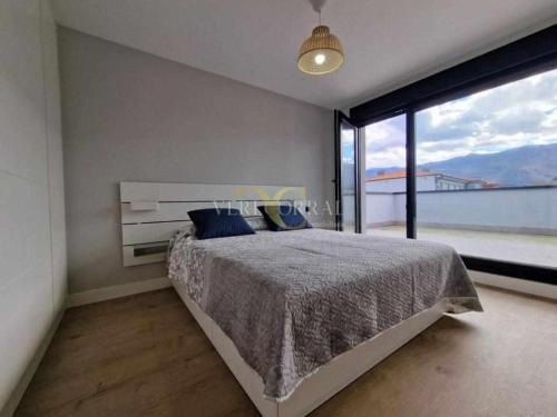 Postel nebo postele na pokoji v ubytování Maravilloso ático en Llanes