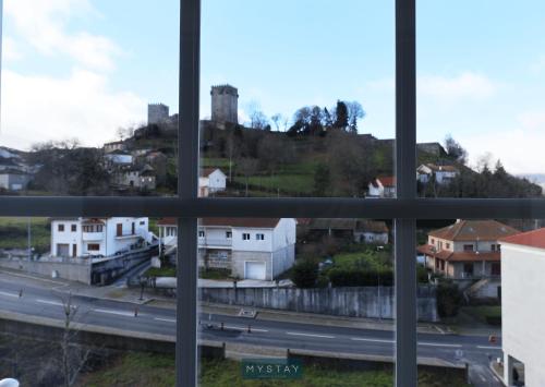a view of a city from a window at MyStay - Casa Miná in Montalegre