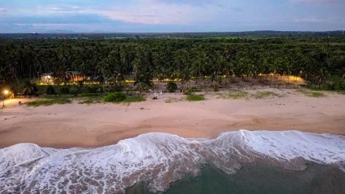 an aerial view of a beach at night at Helios Beach Resort in Tangalle