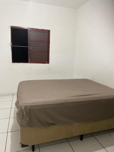 Ένα ή περισσότερα κρεβάτια σε δωμάτιο στο Quarto em frente moradia unicamp