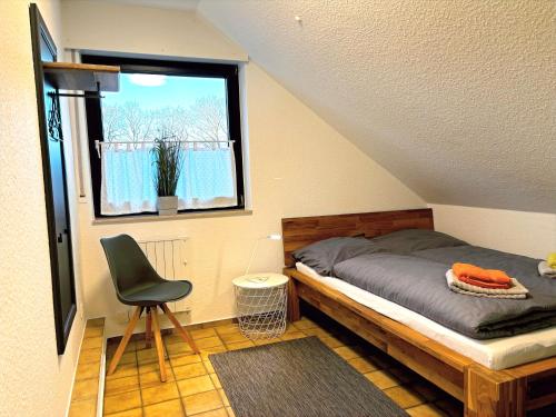 Ένα ή περισσότερα κρεβάτια σε δωμάτιο στο Ferienhaus Wacholderhain