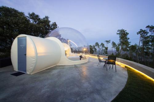 a building with a glass dome on top of it at Glamping Balú in Monesterio