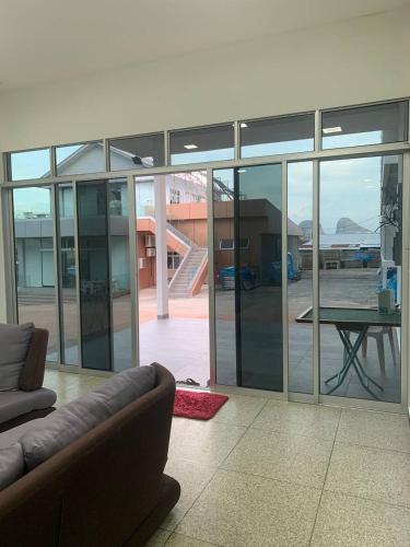 a living room with a couch and a table at 365 Homestay in Kaki Bukit