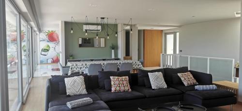a living room with a couch and a table at VERDVILLAGE in Valença
