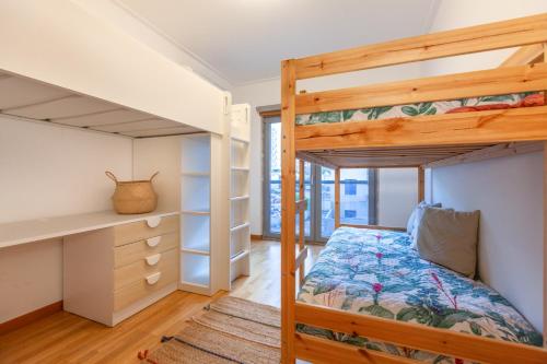 Lliteres en una habitació de Apartamento Lisboa Sete Rios