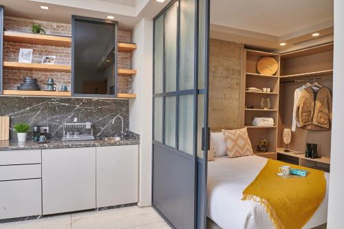 a bedroom with a bed and a closet at Stayhere Casablanca - Gauthier 3 - Urban Residence in Casablanca