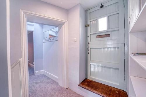 a white door in a hallway with a window at Deluxe Gem of Bath - Football Table - Sleeps 10 in Bath