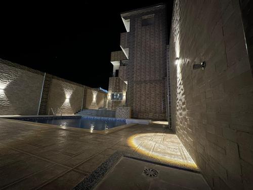 a swimming pool in a building at night at King House in Sharm El Sheikh