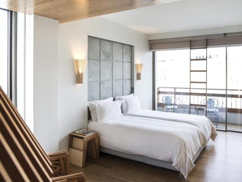 Postel nebo postele na pokoji v ubytování New Hotel