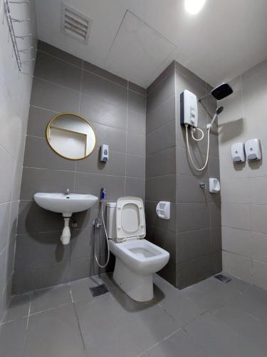 a bathroom with a shower and a toilet and a sink at 3 Elements* The Garden* MRT2* Wifi* Self Check-In in Kampong Batu Sembilan