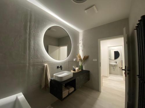 a bathroom with a sink and a mirror at Loft Vrchlabí in Vrchlabí