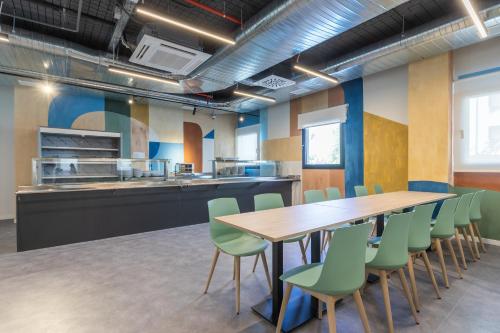 a conference room with a table and chairs at Micampus Getafe II Student Residence in Getafe