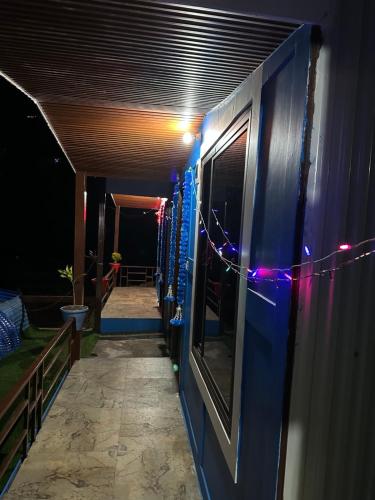 a row of vending machines with christmas lights on them at Lake Haven Resort, Sari, Chopta in Sari