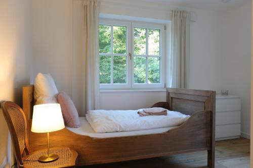 Cama o camas de una habitación en Reetdachhaus in der Bremer Schweiz