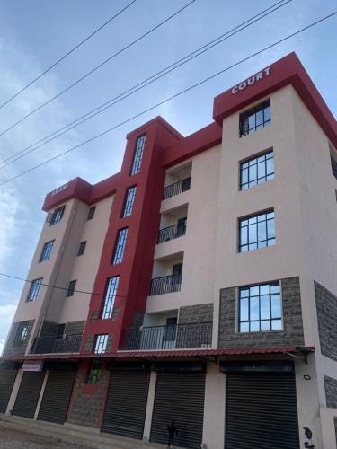 a building with a red and white at Rorot 1 bedroom annex Eldoret,Arlene in Eldoret